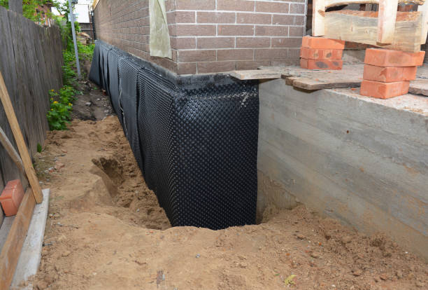 SJ Waterproofing Pros technician performing targeted Vapor Barrier Installation assessment in Valley Stream, NY